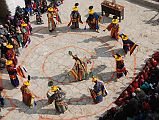Mustang Lo Manthang Tiji Festival Day 1 04-4 Dorje Jono And Monks Dance I climbed the stairs of the Kings Palace to the roof for an overhead view of the mandala supporting the first dance of the Tiji Festival in Lo Manthang.